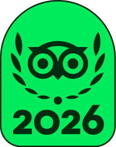 A green badge featuring a stylized owl face surrounded by laurel branches above the numbers 2026.